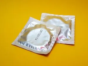 Condoms on a yellow background