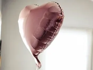 A heart-shaped inflated helium balloon